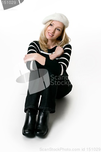 Image of Casual female in jeans sitting