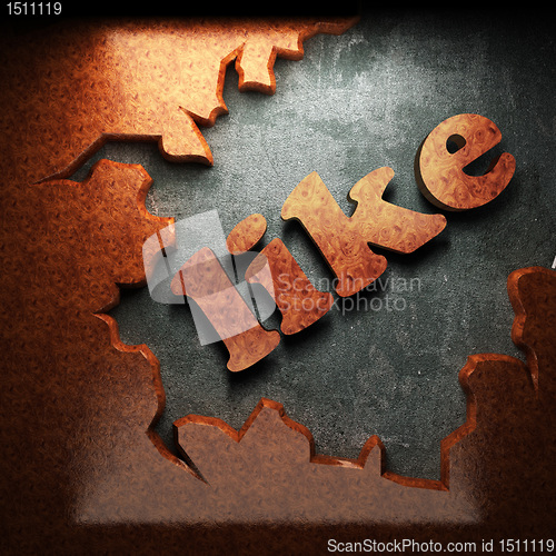 Image of red wood word on concrete