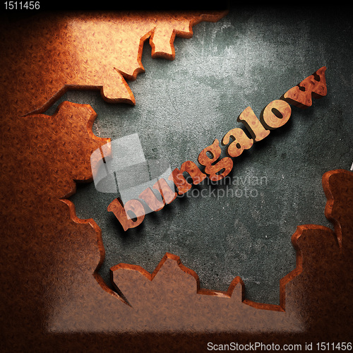 Image of red wood word on concrete