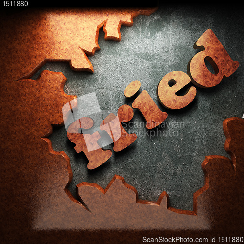Image of red wood word on concrete