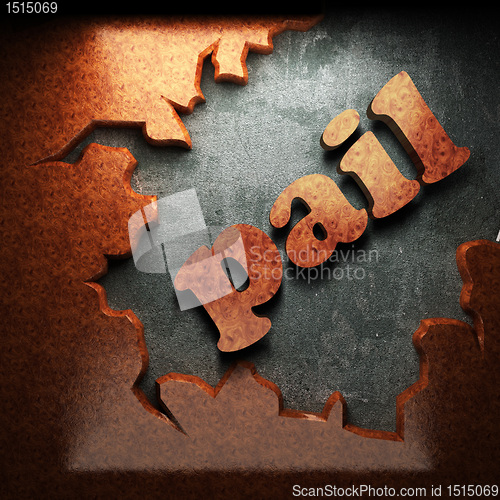 Image of red wood word on concrete
