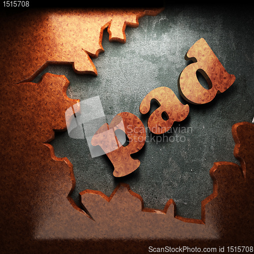 Image of red wood word on concrete