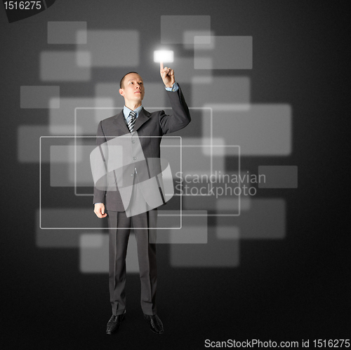 Image of full length businessman push the button