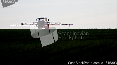 Image of tractor spraying agricultural pesticide