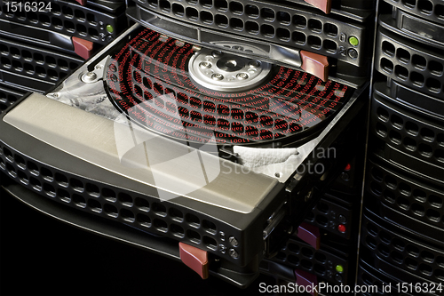 Image of open hard disk with symbolized data