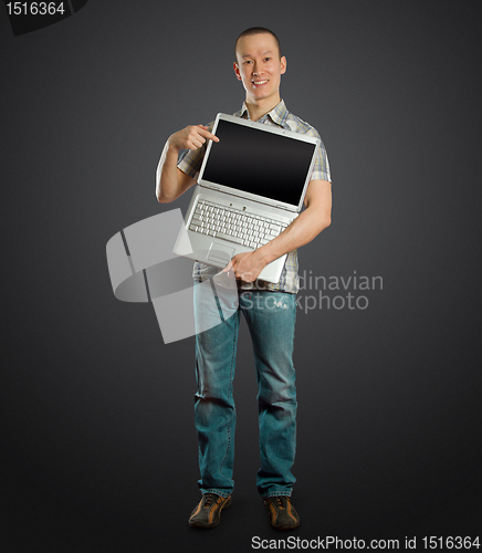 Image of man with open laptop in his hands