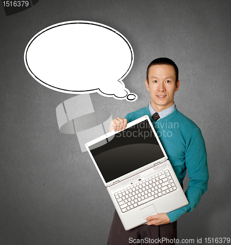 Image of Male in blue with laptop and comics bubble