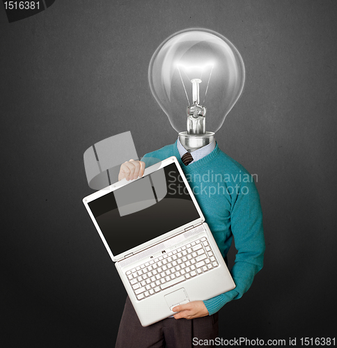 Image of Male with lamp-head in blue with laptop