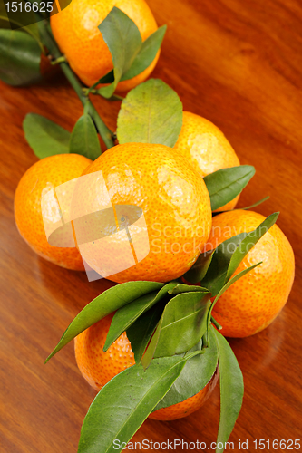 Image of mandarin on wooden background