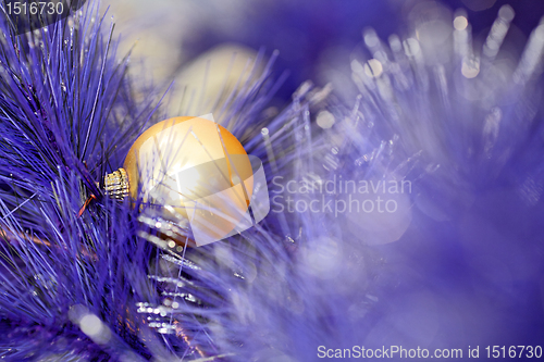 Image of christmas ball on blue color christmas tree