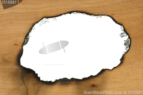 Image of Burned wooden paper and hole