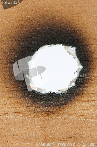 Image of Burned wooden paper and hole
