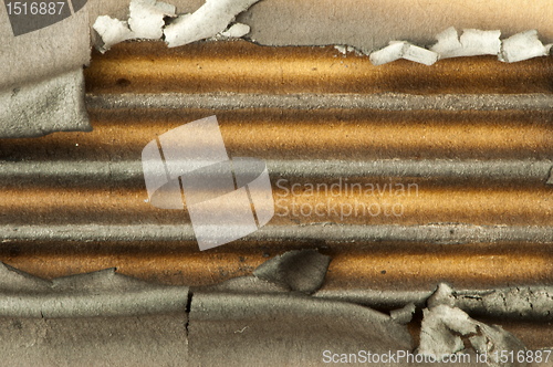Image of Burned paper and hole