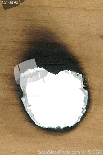 Image of Burned wooden paper and hole