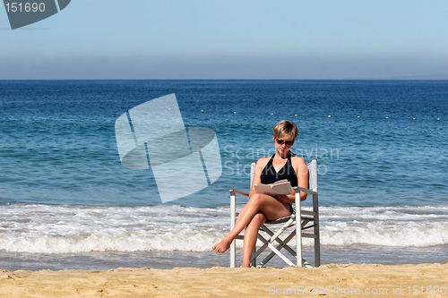 Image of Woman relaxing on a beach