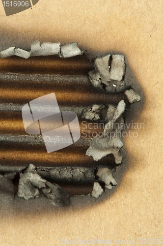 Image of Burned paper and hole