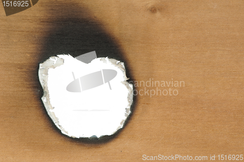 Image of Burned wooden paper and hole