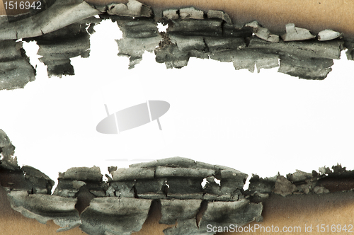 Image of Burned paper and hole