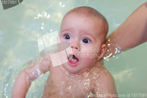 Image of Small baby bathing