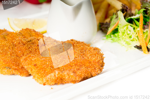 Image of classic Milanese veal cutlets and vegetables