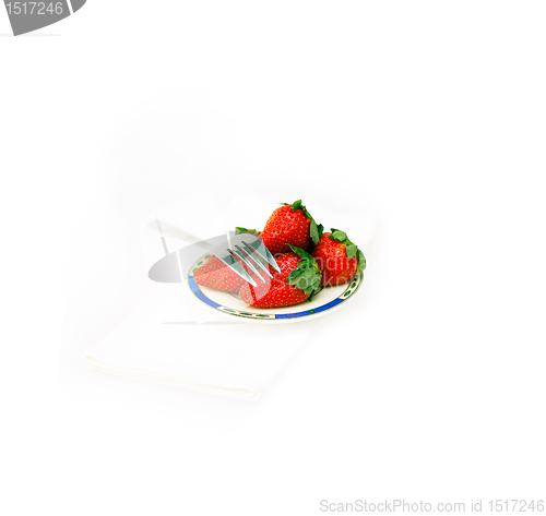 Image of fresh strawberries dish over white