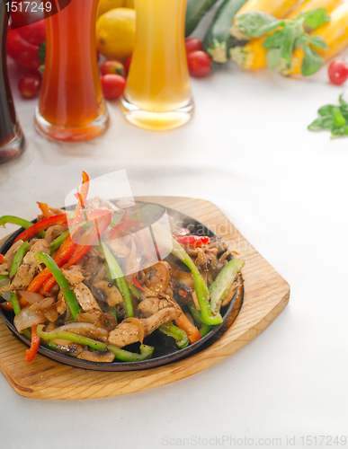 Image of original fajita sizzling hot  on iron plate