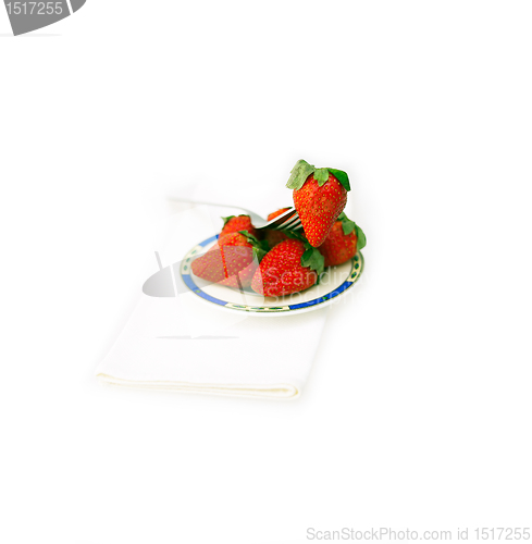Image of fresh strawberries dish over white