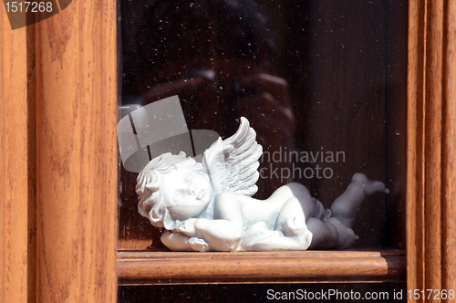 Image of white ceramic angel on the sill