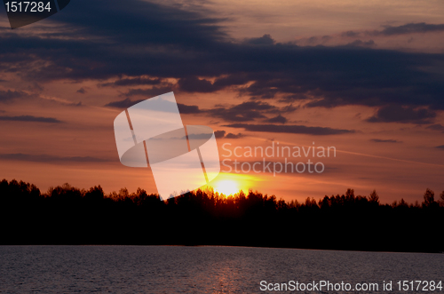 Image of Colorful sunrise over the lake. 