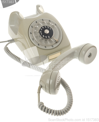 Image of Old vintage rotary style telephone - handset off