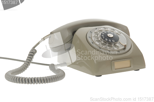 Image of An old gray vintage rotary style telephone