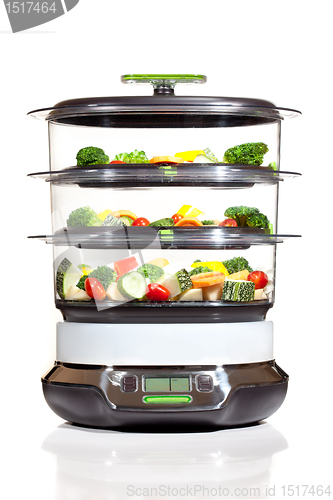 Image of Healthy cooking, steam cooker with vegetables