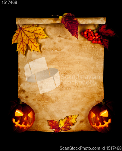 Image of Halloween. Old paper with autumn leaves and pumpkin.