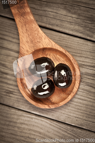 Image of Olives on a wooden table