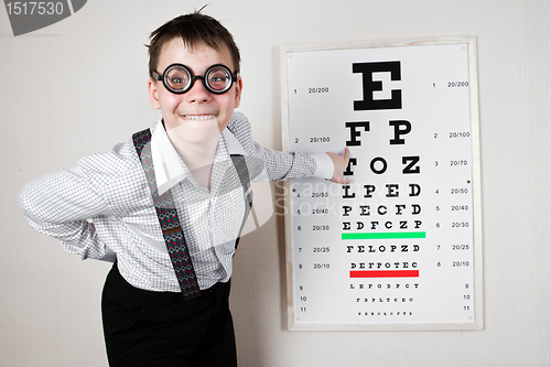 Image of person wearing spectacles in an office at the doctor