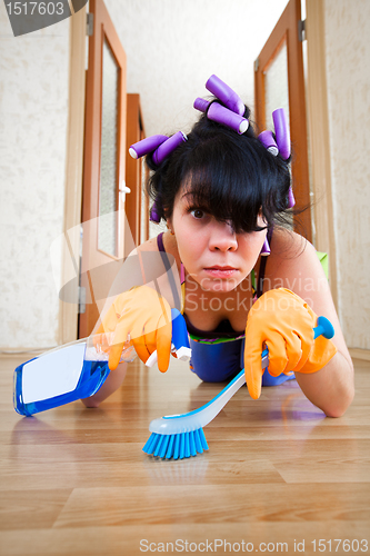 Image of housewife washes a floor