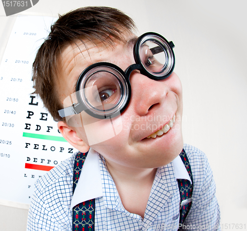 Image of person wearing spectacles in an office at the doctor