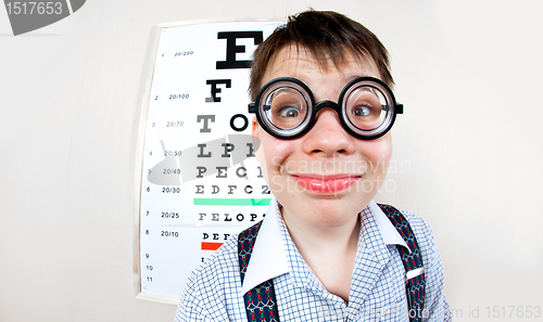 Image of person wearing spectacles in an office at the doctor