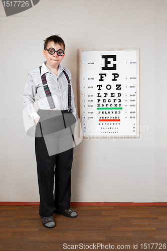 Image of person wearing spectacles in an office at the doctor