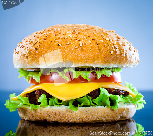 Image of Tasty and appetizing hamburger on a blue