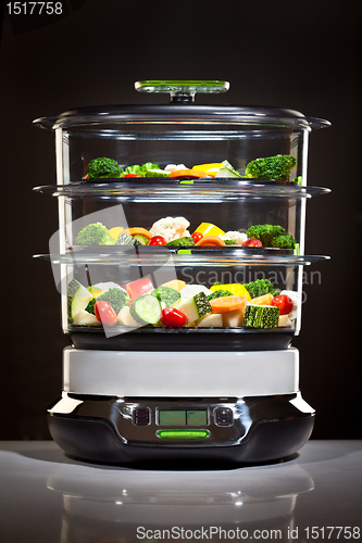 Image of Healthy cooking, steam cooker with vegetables