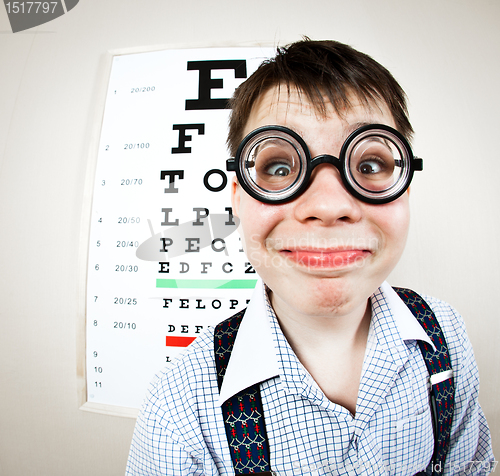 Image of person wearing spectacles in an office at the doctor