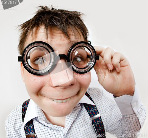 Image of person wearing spectacles in an office at the doctor