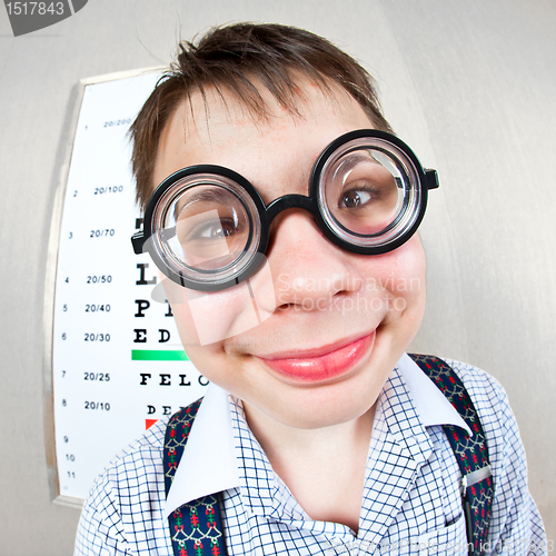 Image of person wearing spectacles in an office at the doctor