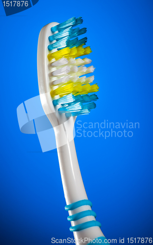 Image of toothbrush on a dark blue background