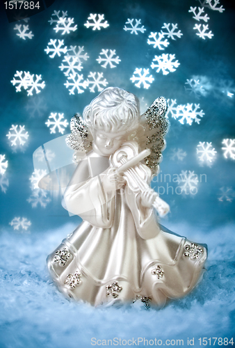 Image of Angel with Blue Holiday Background