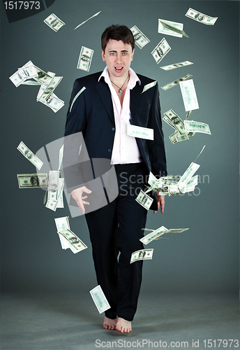 Image of man in a suit throws money