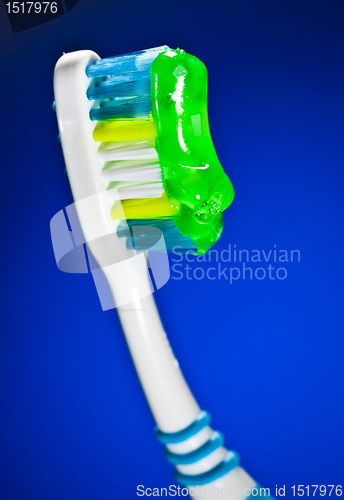 Image of toothbrush on a dark blue background