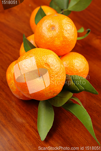 Image of mandarin on wooden background