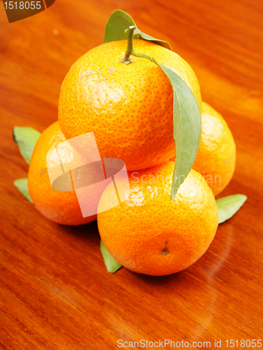 Image of mandarin on wooden background